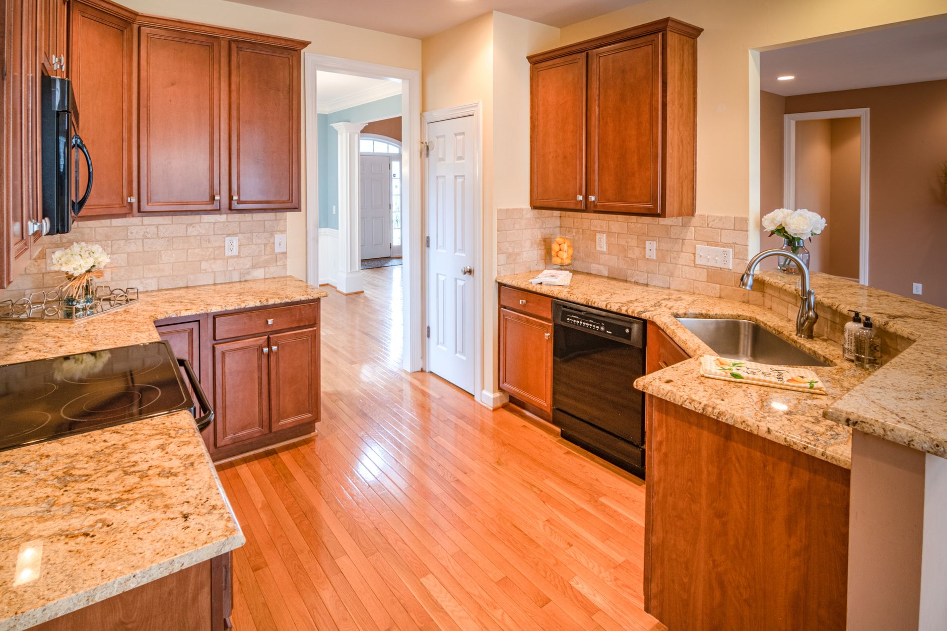 Bright kitchen interior with wooden cabinets and granite countertops in Redding, CA